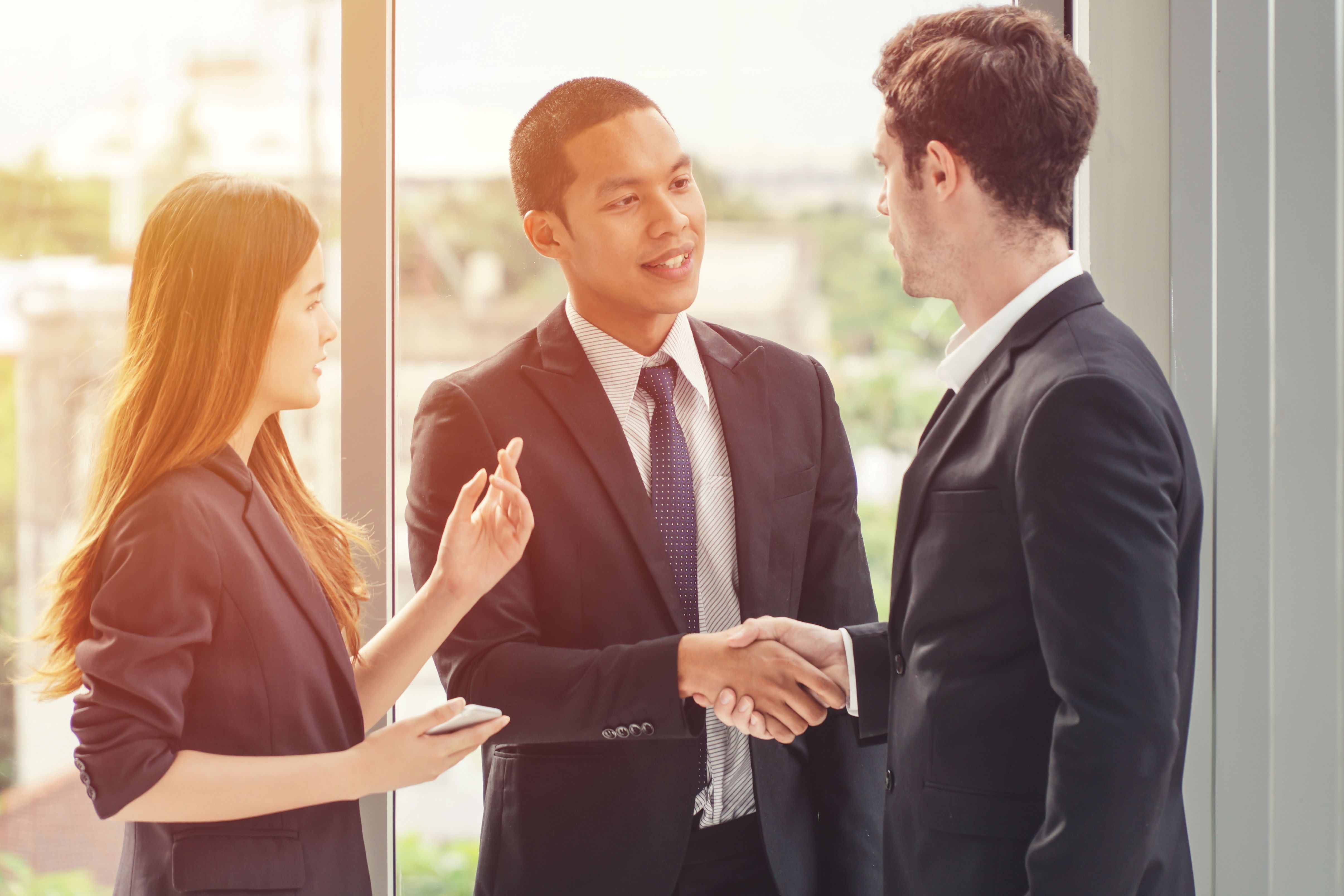 Business meeting with two men shaking hands