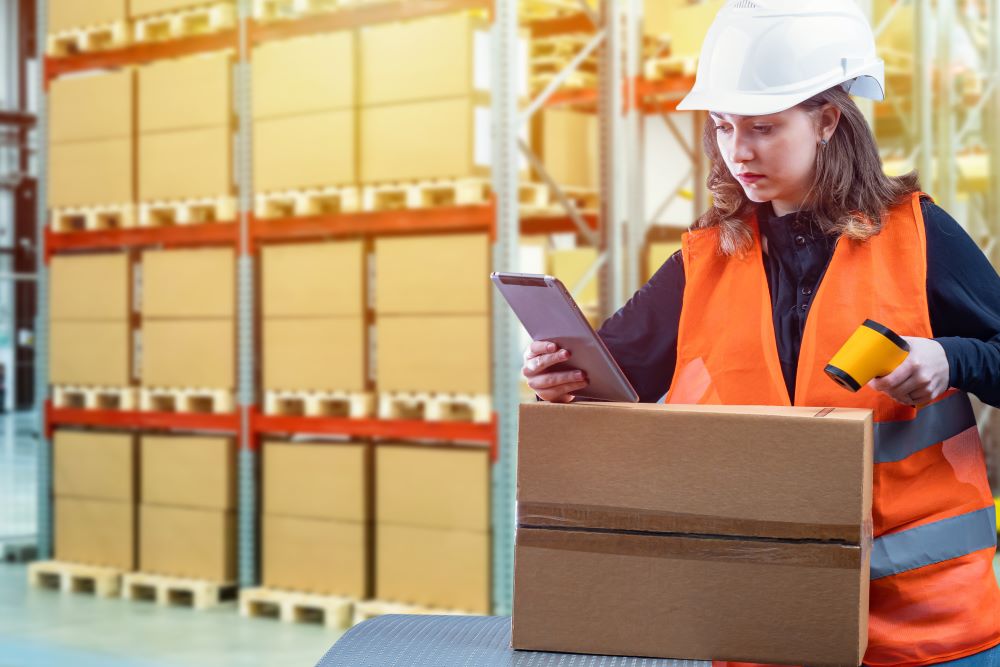 Warehouse working scanning a shipment in a warehouse