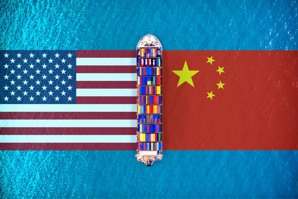 Ship passing between US and Chinese flags